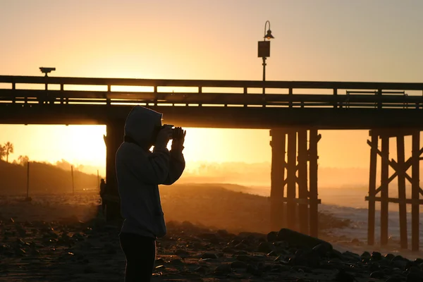 Photographe au coucher du soleil — Photo