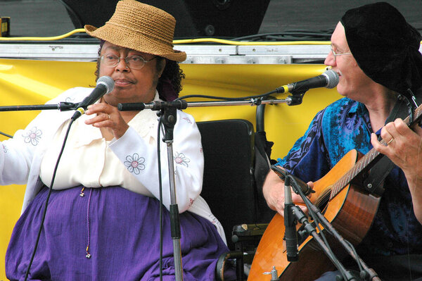 SEATTLE, WA. JULY 29, 2006. USA. CIRCA: Interracial street musicians performing outside for donations.
