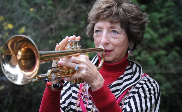 Mature Female Senior Trumpet Player Blowing Her Horn — Stock Photo, Image