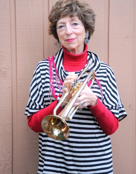 Mature Female Senior Trumpet Player Blowing Her Horn — Stock Photo, Image