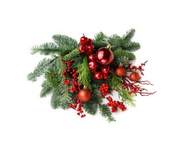 Christmas floristic composition of natural spruce branches (nobilis fir), red Christmas balls on white background
