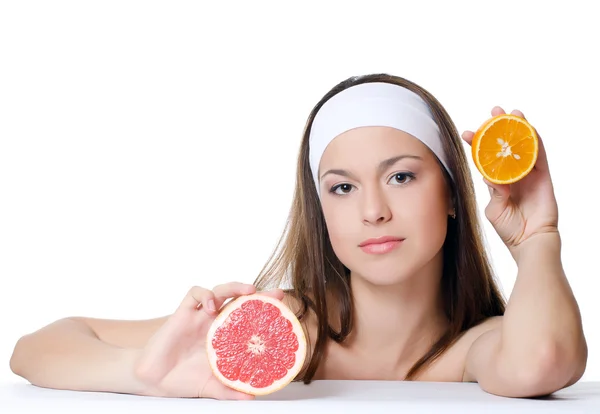 The beautiful woman with a grapefruit — Stock Photo, Image
