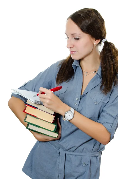 Het mooie meisje met boeken geïsoleerd op wit — Stockfoto