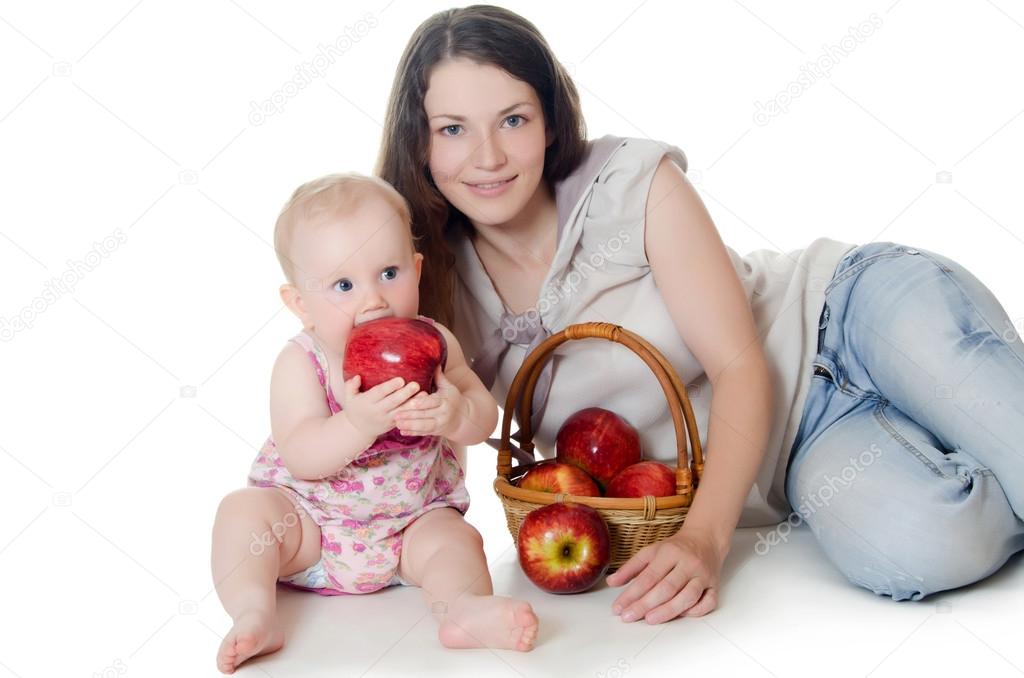 The little baby with red apples