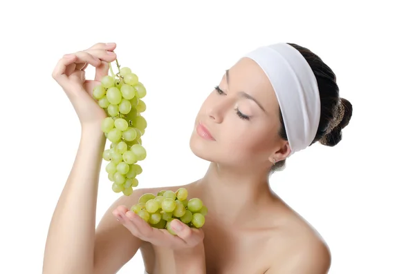 The beautiful woman with grapes — Stock Photo, Image