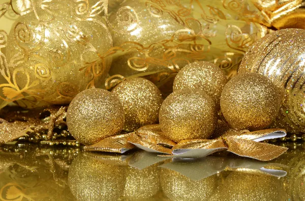 The christmas tree ornaments on gold — Stock Photo, Image