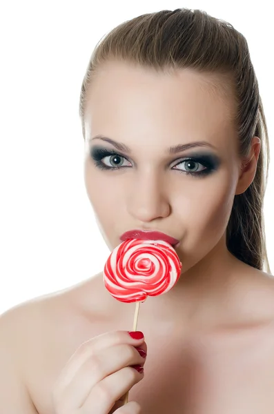 La ragazza con una caramella da zucchero — Foto Stock