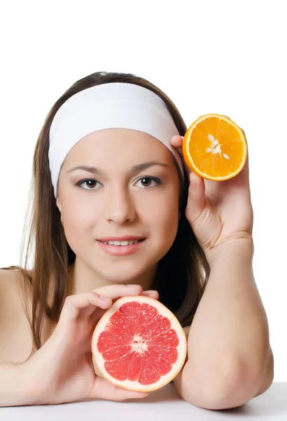 The beautiful woman with a grapefruit — Stock Photo, Image