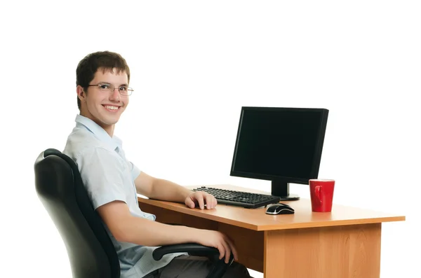 与计算机的桌子后面的商人 — 图库照片