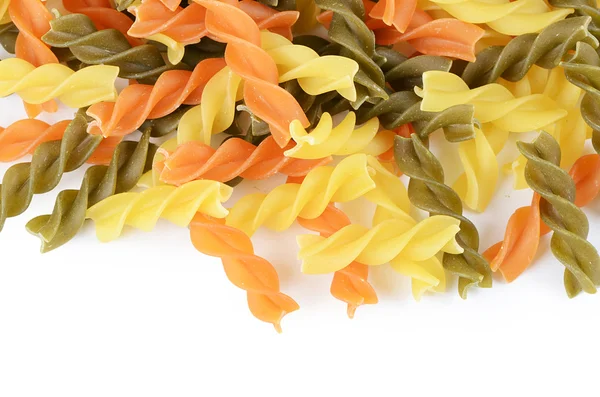 Raw colored pasta fusilli isolated on white background — Stock Photo, Image