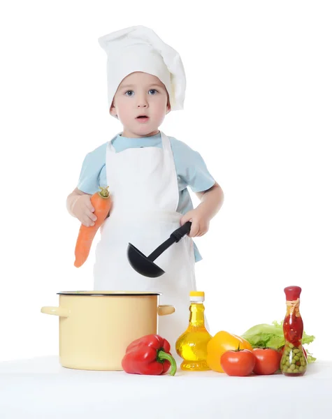 Le petit garçon dans un chapeau du cuisinier — Photo