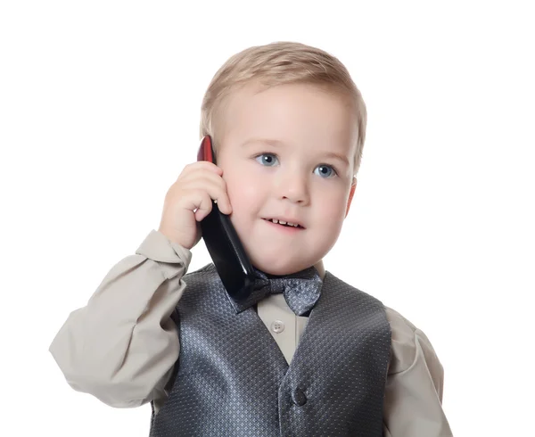 El niño con traje de negocios habla por teléfono. — Foto de Stock