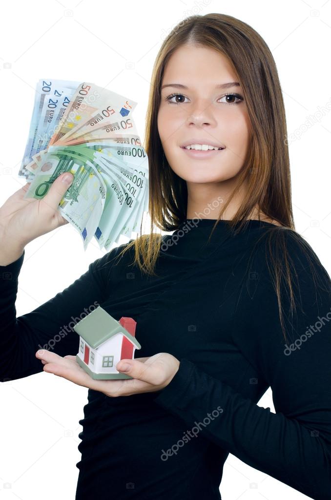 The business woman with the toy house and banknotes