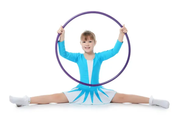 Klein meisje de gymnast oefent — Stockfoto