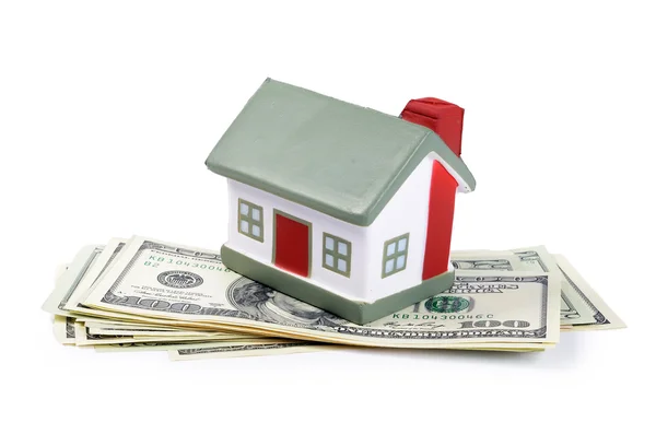 Toy house for dollar banknotes as a background — Stock Photo, Image