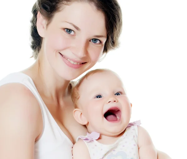 Szczęśliwa matka z dzieckiem w bieli — Zdjęcie stockowe