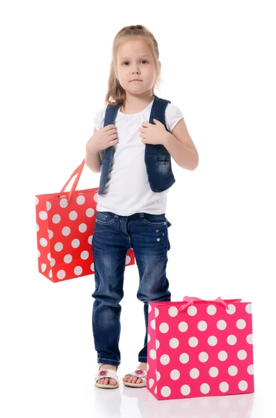 A menina com dois pacotes isolados — Fotografia de Stock