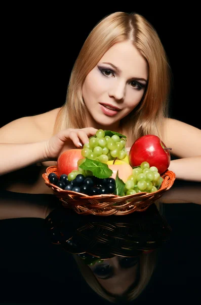 The beautiful woman with basket of fruit — Stock Photo, Image