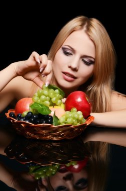 The beautiful woman with basket of fruit clipart