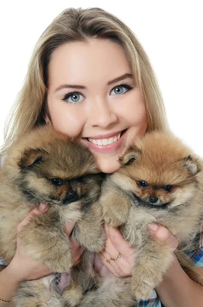 The beautiful girl with a puppy spitz — Stock Photo, Image