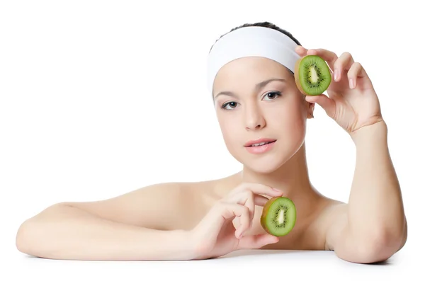 The beautiful woman with a kiwi — Stock Photo, Image