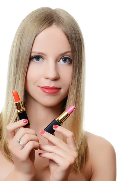 The beautiful girl with lipsticks in hands — Stock Photo, Image