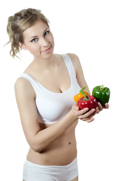 The beautiful girl with fresh pepper — Stock Photo, Image