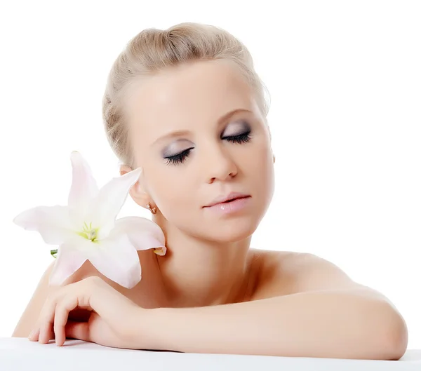 The beautiful blonde woman with lily flower — Stock Photo, Image