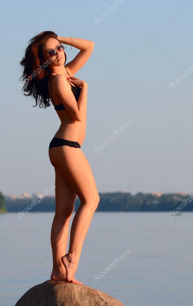 The beautiful woman in underwear on a beach Stock Photo by