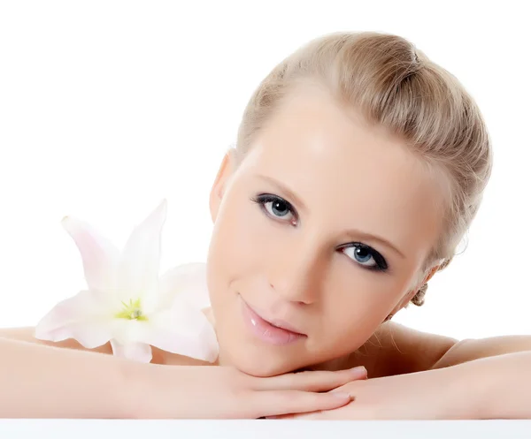 The beautiful blonde woman with lily flower — Stock Photo, Image