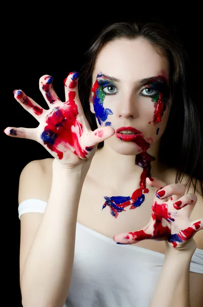 The beautiful woman with a paint on the face — Stock Photo, Image