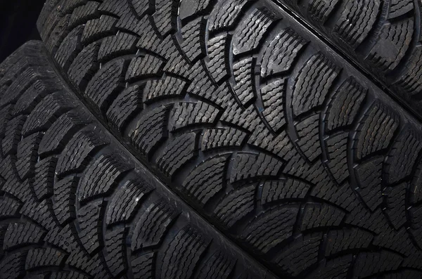 The automobile tire on black background — Stock Photo, Image