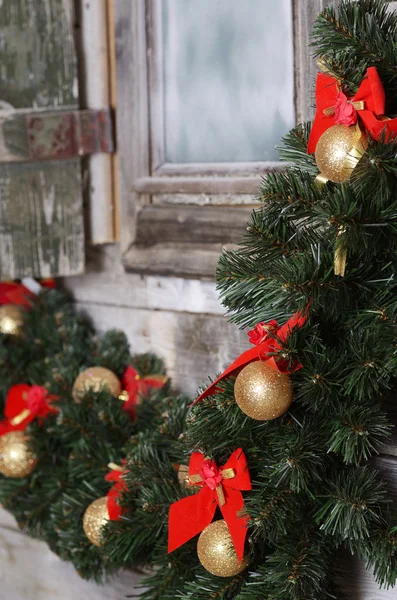 Christmas branch of a fur-tree on a wall — Stock Photo, Image