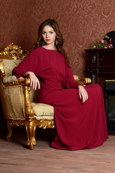 Young woman in a claret dress — Stock Photo, Image