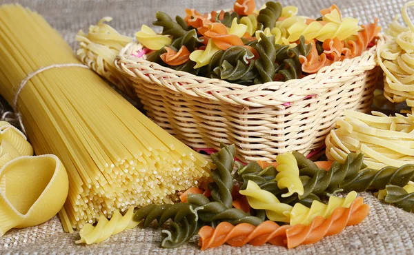 Raw colored pasta fusilli sa a background — Stock Photo, Image
