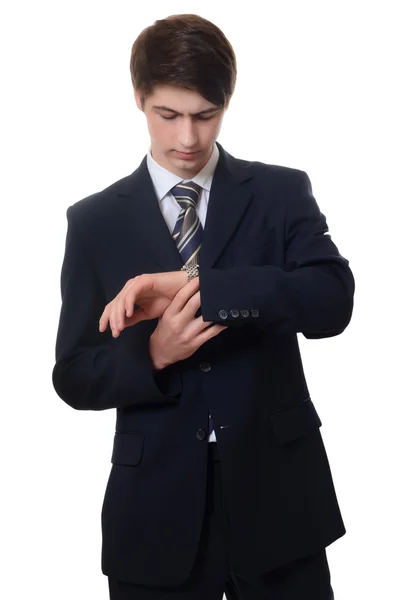 El hombre de negocios en un traje de negocios mira el reloj — Foto de Stock