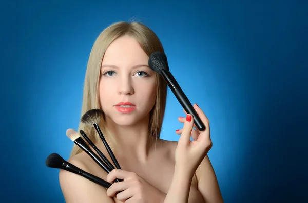 The beautiful girl with brushes make-up — Stock Photo, Image