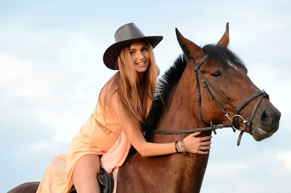 Woman on a horse — Stock Photo, Image