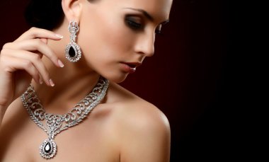 The beautiful woman in expensive pendant clipart