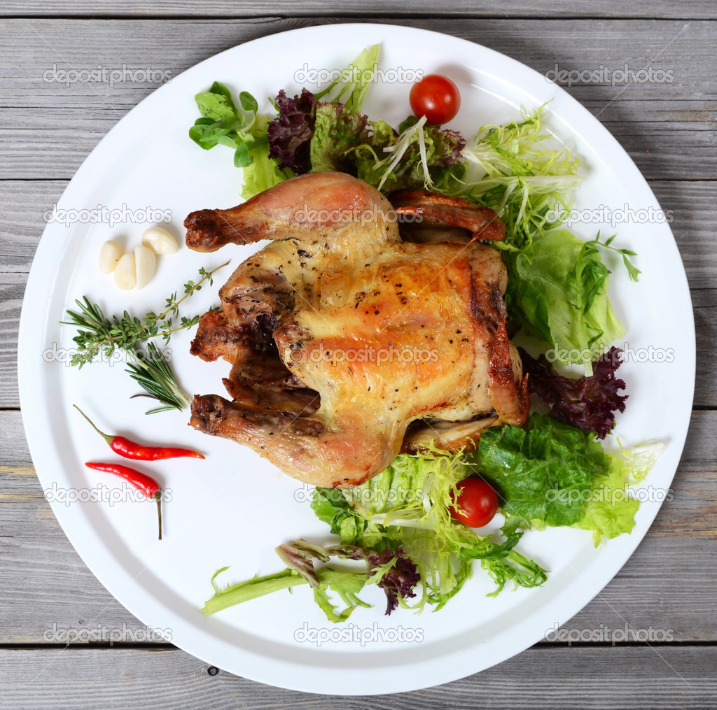 Baked hen with salad