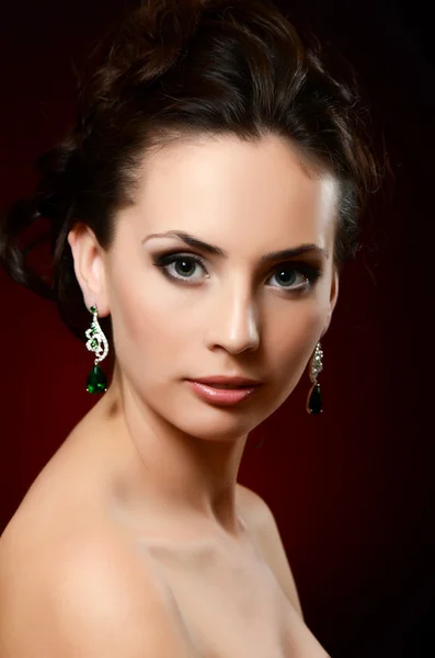 Woman in jewelry earrings — Stock Photo, Image