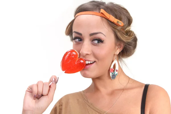 Beautiful girl with a lollipop — Stock Photo, Image