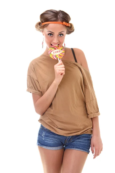 A pretty girl who eats candy — Stock Photo, Image
