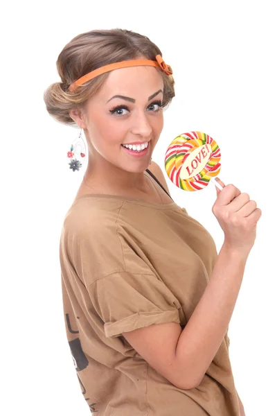 Lány a kezében pózol a candy — Stock Fotó