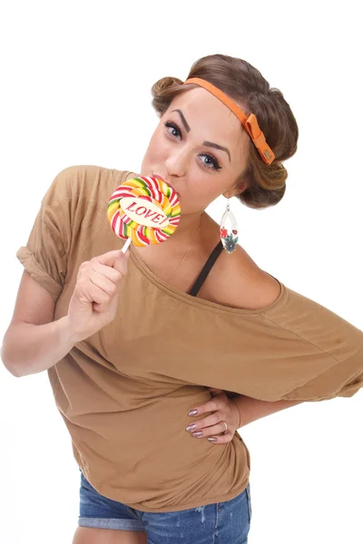 A pretty girl who eats candy — Stock Photo, Image