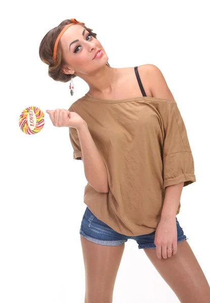 Chica posando con caramelo en la mano —  Fotos de Stock