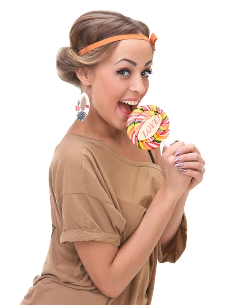 Uma menina bonita que come doces — Fotografia de Stock