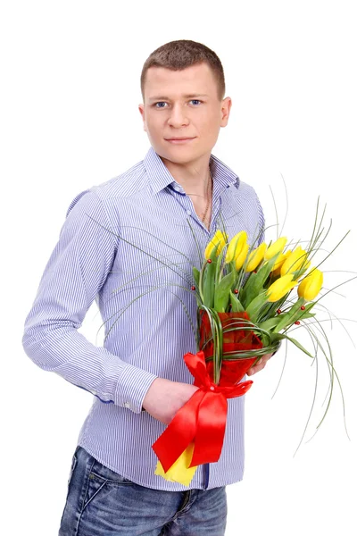 Jonge man met een boeket van tulpen — Stockfoto
