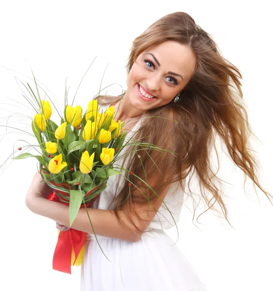 Happy woman with yellow tulips — Stock Photo, Image