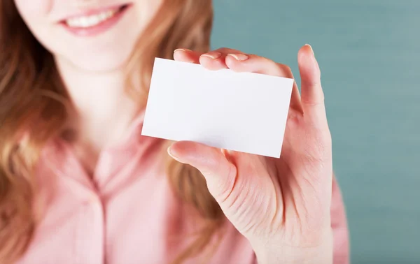 Business woman holding her visiting card — Stock Photo, Image